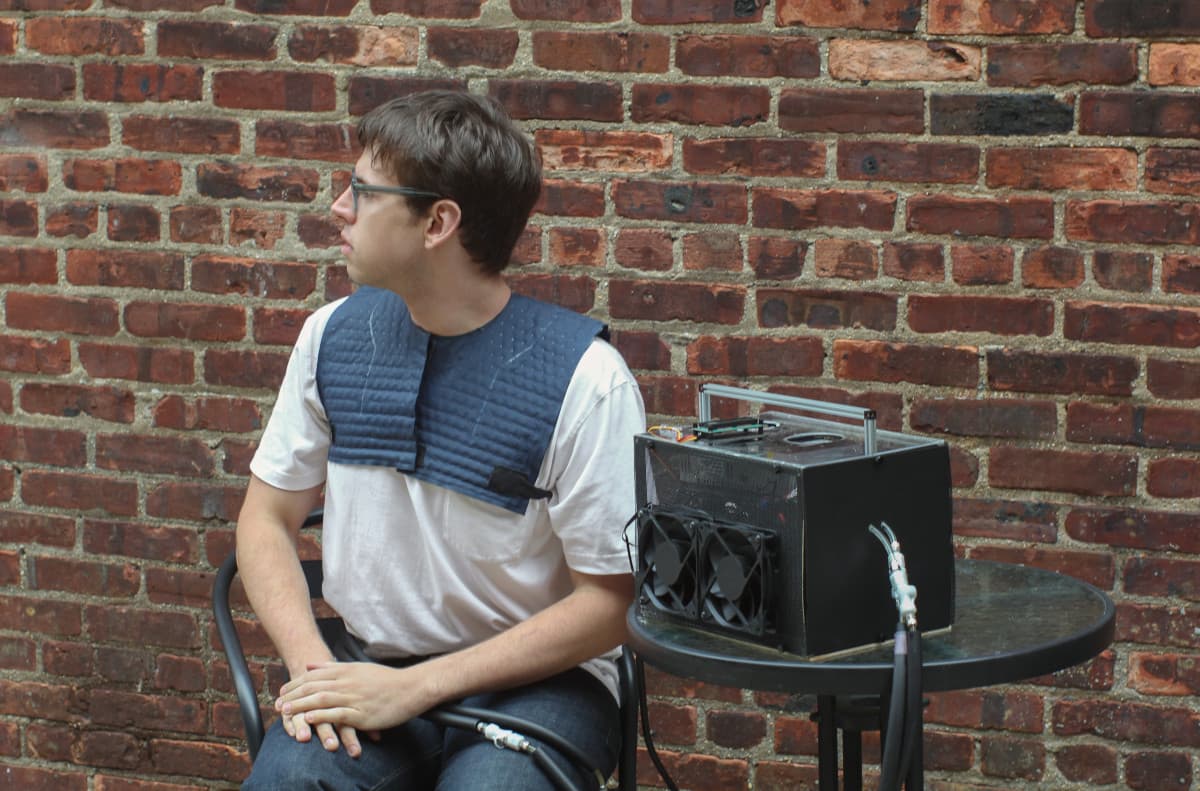 Image of Erik showing off the garment and hub